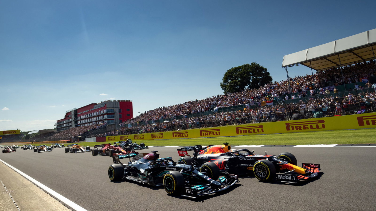 Lewis Hamilton and Max Verstappen go side-by-side at the 2021 British Grand Prix.