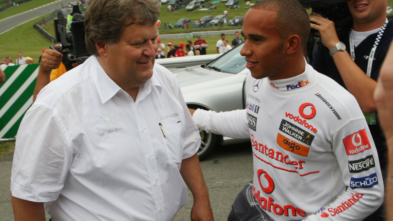 Norbert Haug pictured with Lewis Hamilton in 2008