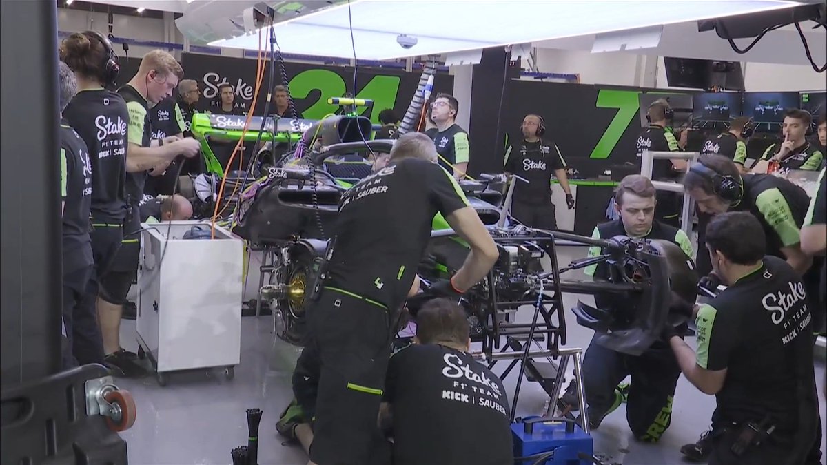 Zhou Guanyu's car being worked on