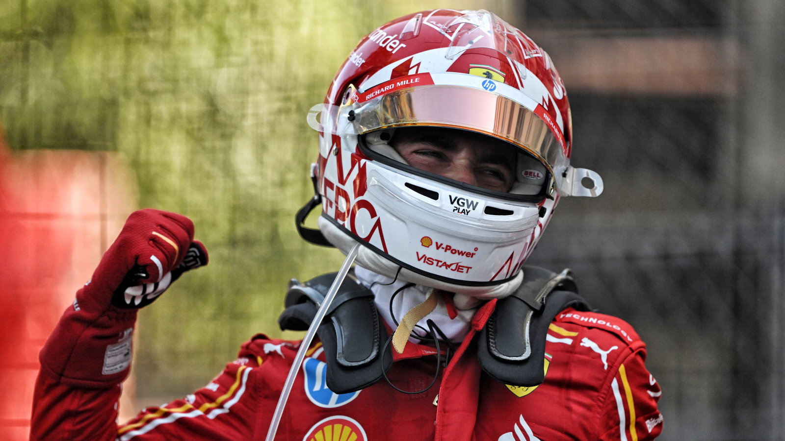 Charles Leclerc celebrates his first win at home