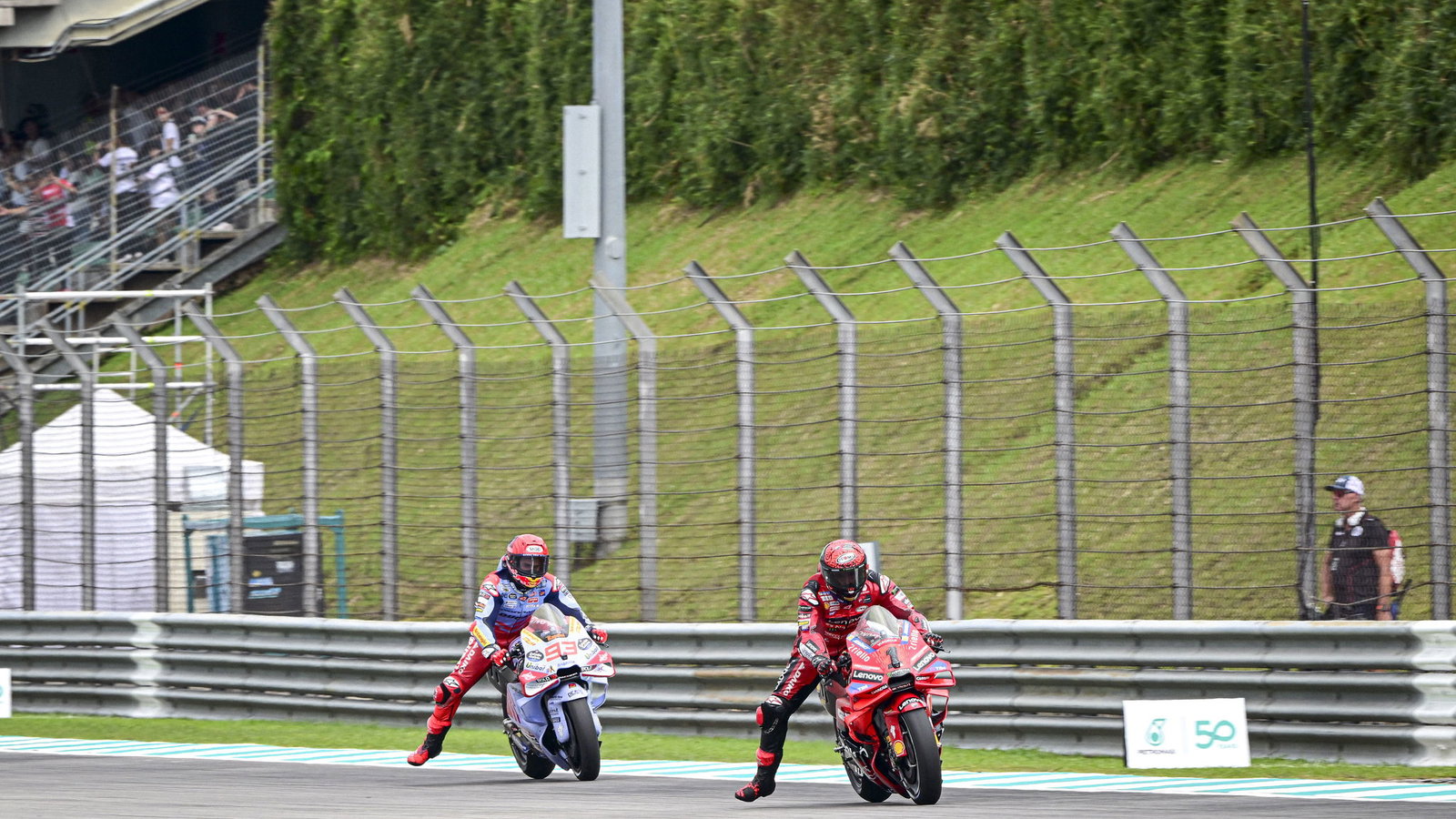 Francesco Bagnaia, Marc Marquez, 2024 MotoGP Malaysian Grand Prix, pit box. Credit: Gold and Goose.