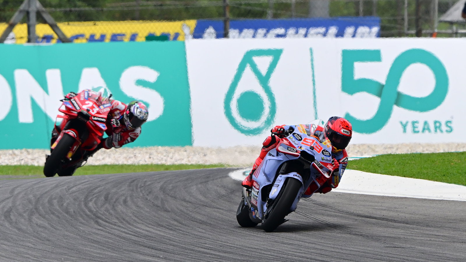 Marc Marquez, Enea Bastianini, 2024 MotoGP Malaysian Grand Prix. - Gold and Goose