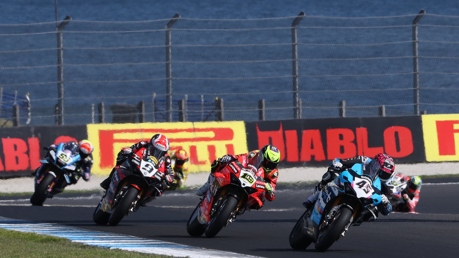 Scott Redding leads Alvaro Bautista, Danilo Petrucci, 2025 Australian WorldSBK. Credit: Gold and Goose.