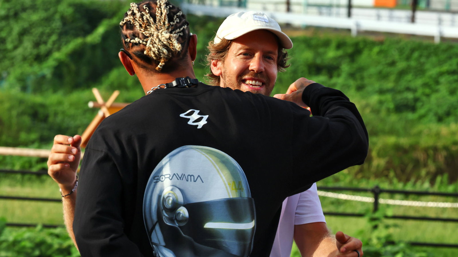 Sebastian Vettel embraces Lewis Hamilton