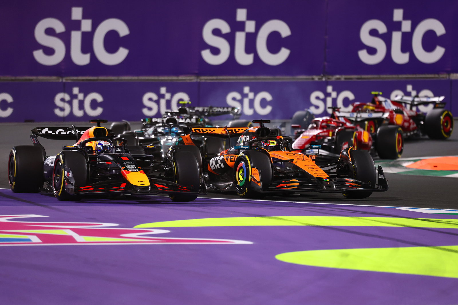 Verstappen and Piastri go wheel-to-wheel at the start 