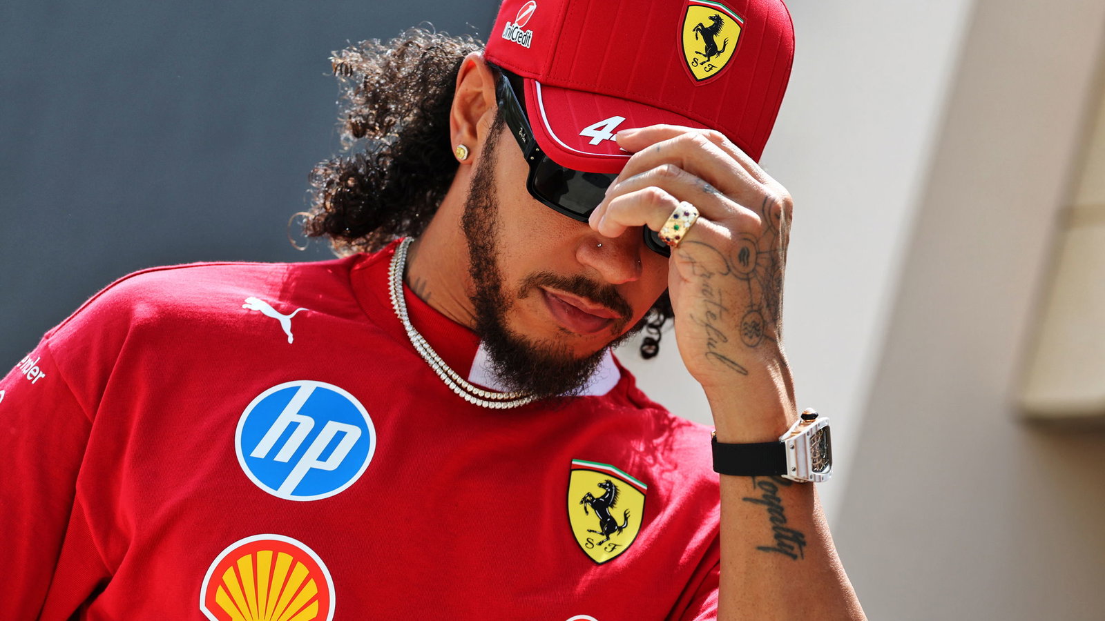 Lewis Hamilton arrives in the Bahrain paddock on Thursday