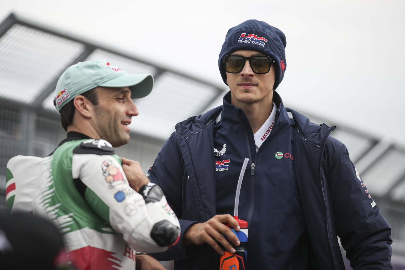 Johann Zarco, Luca Marini, 2025 MotoGP German Grand Prix, pit lane. Credit: Gold and Goose.