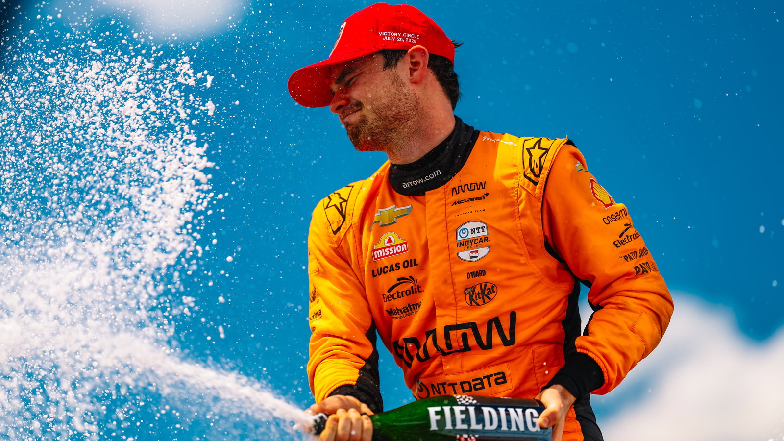 Pato O'Ward with champagne.