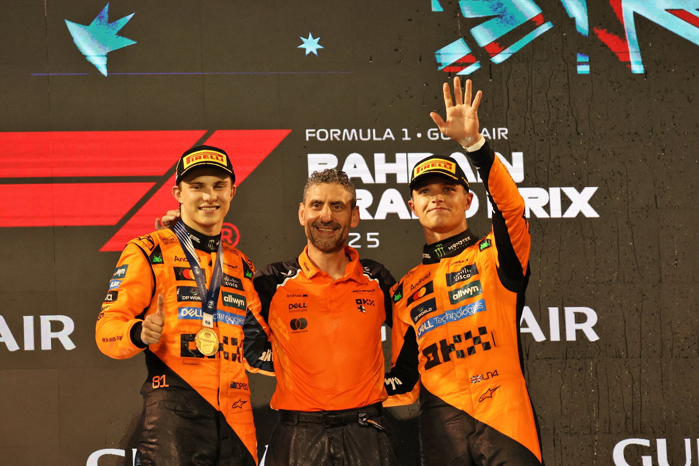 Lando Norris and Oscar Piastri with Andrea Stella