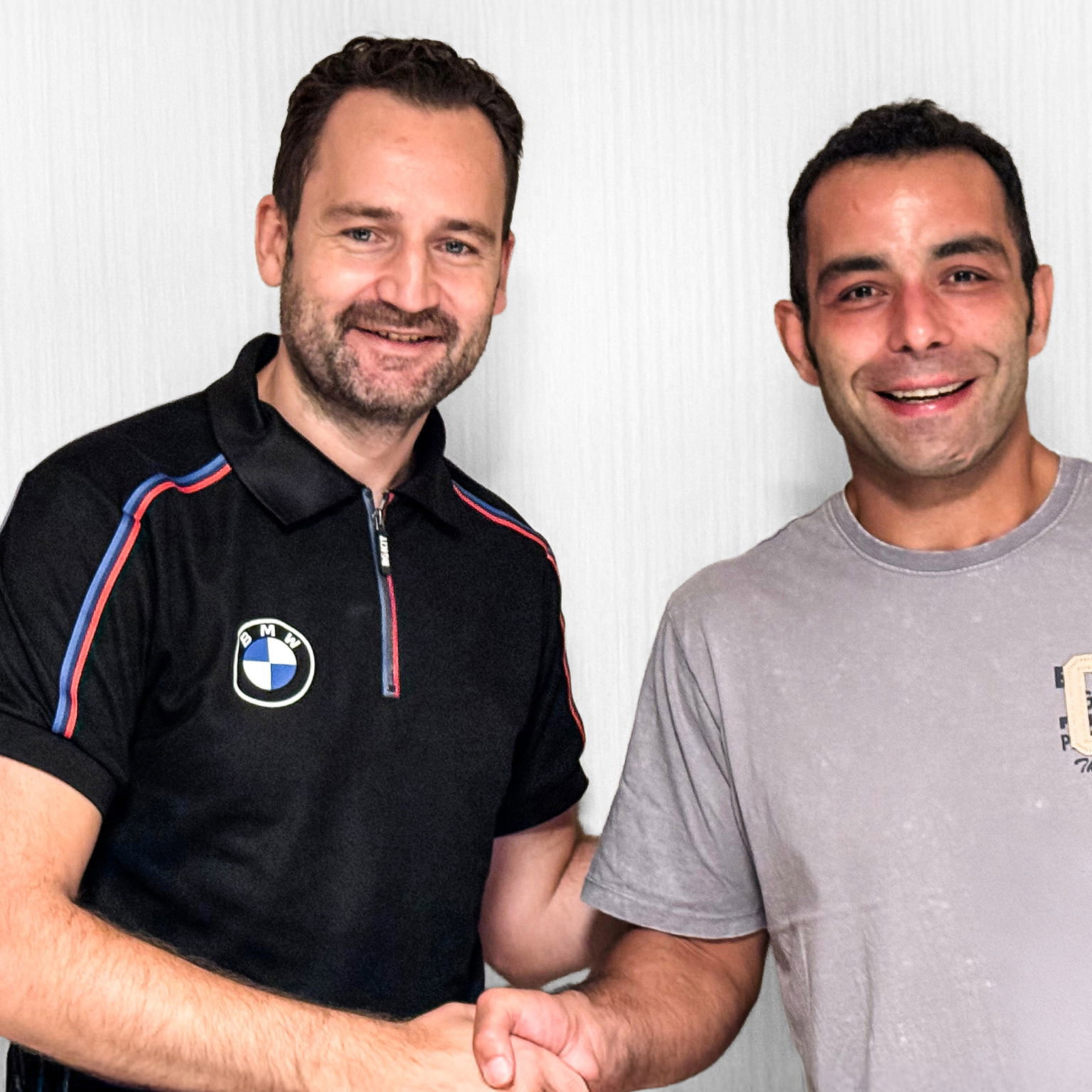 Sven Blusch shakes hands with Danilo Petrucci. Credit: BMW.