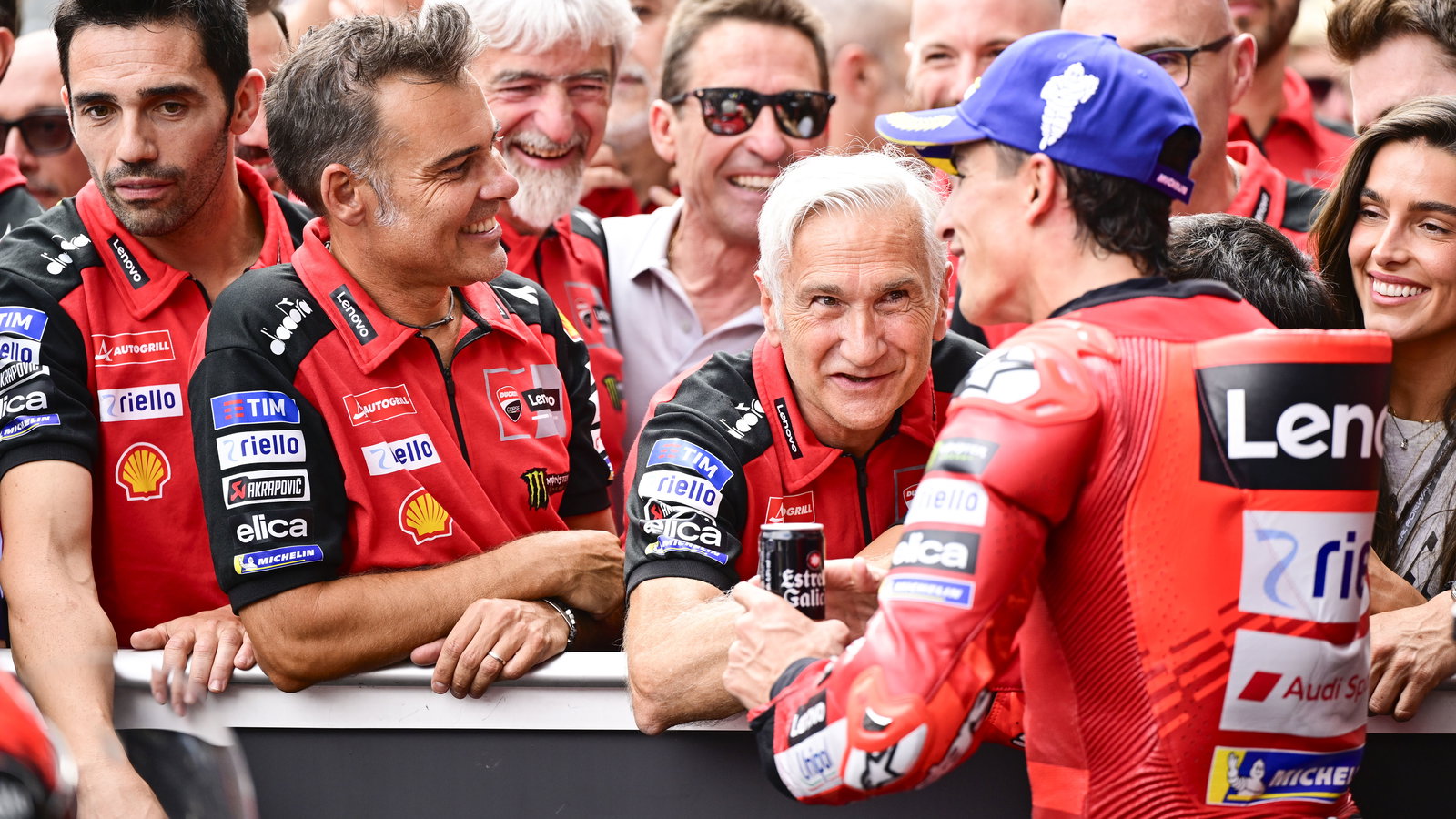 Marc Marquez speaks with Davide Tardozzi, Marco Rigamonti, 2025 MotoGP Austrian Grand Prix, parc ferme. Credit: Gold and Goose.