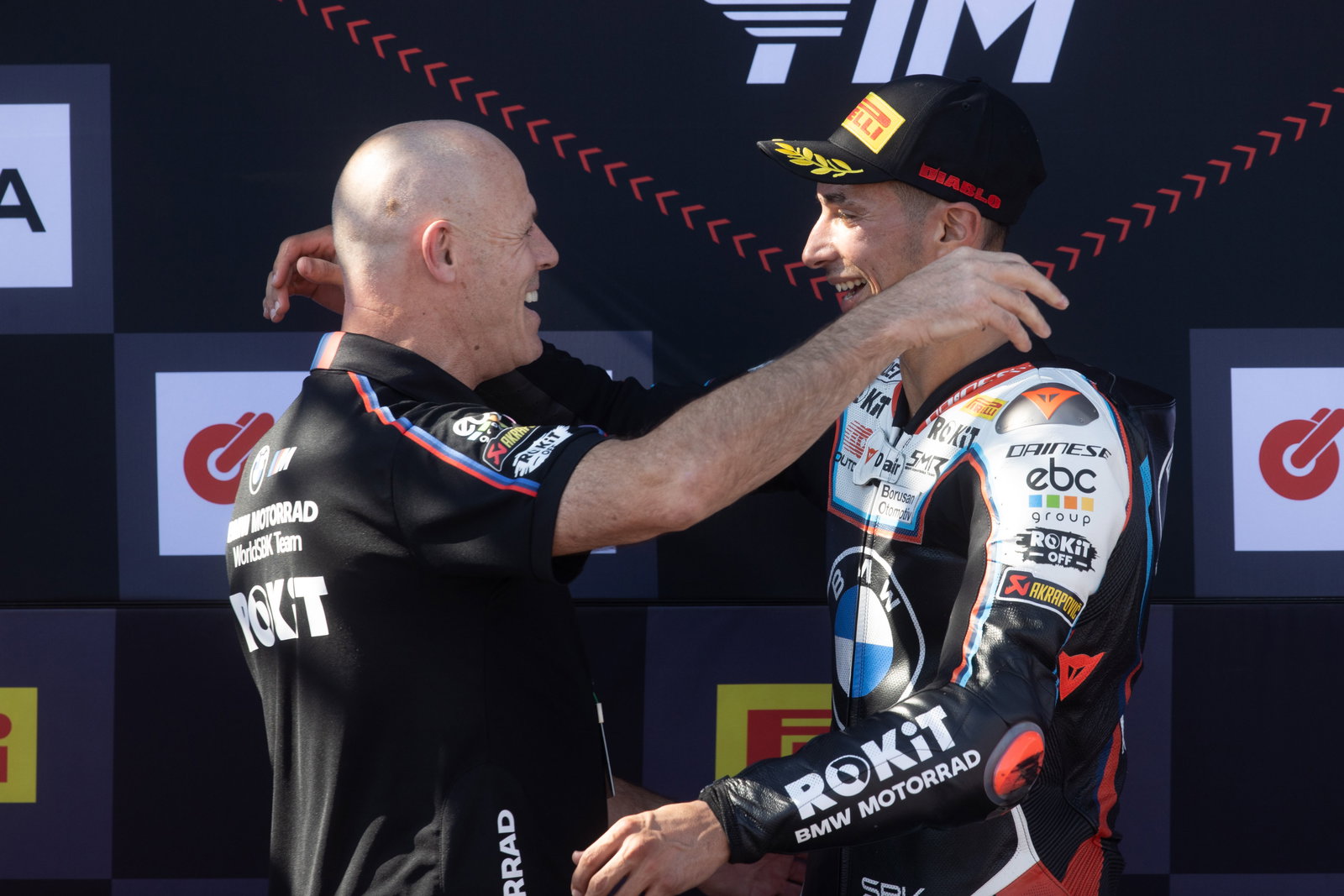 Shaun Muir, Toprak Razgatlioglu, 2025 Estoril WorldSBK, podium. Credit: Gold and Goose.