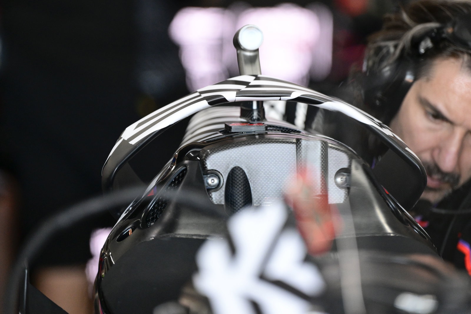 Hoop rear wing on Marco Bezzecchi's Aprilia, 2025 MotoGP Valencia Test, pit box. Credit: Gold and Goose.