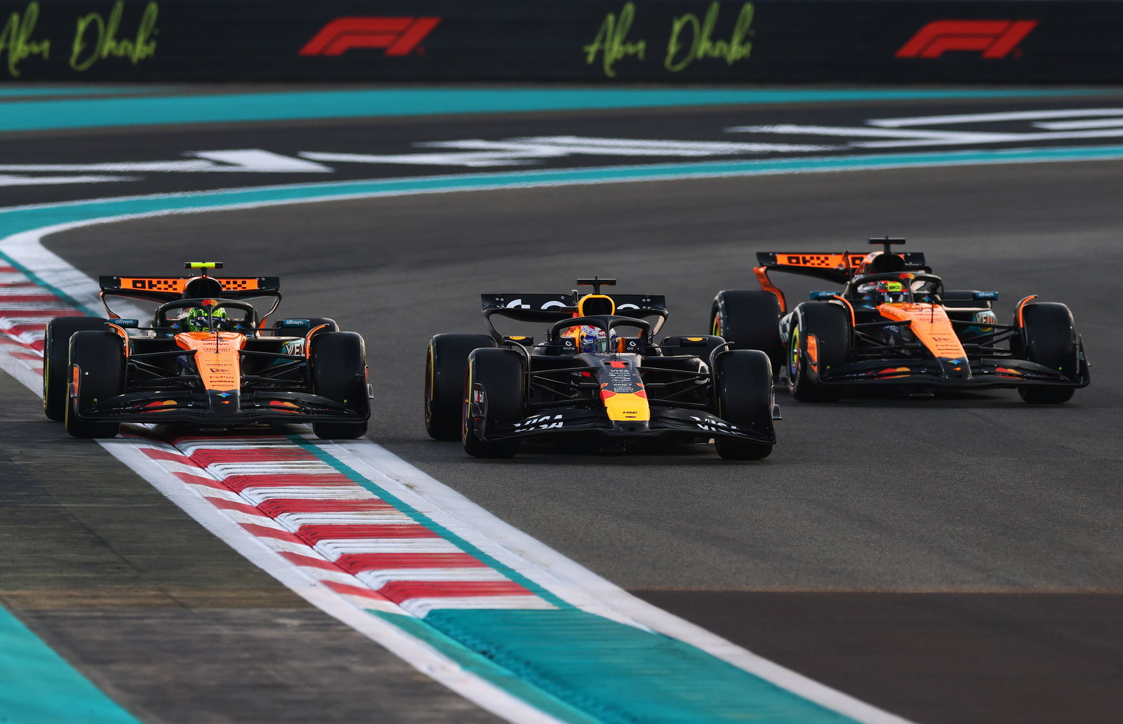Verstappen fends off the McLarens at the start