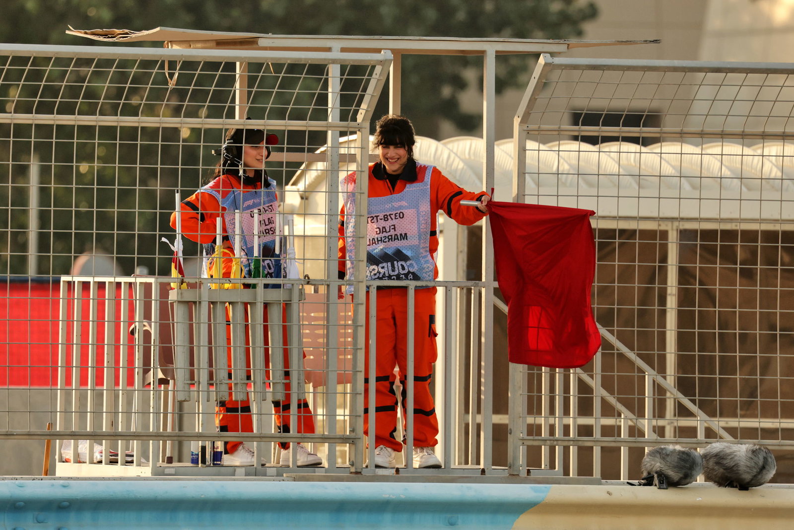 A marshal holds out a red flag
