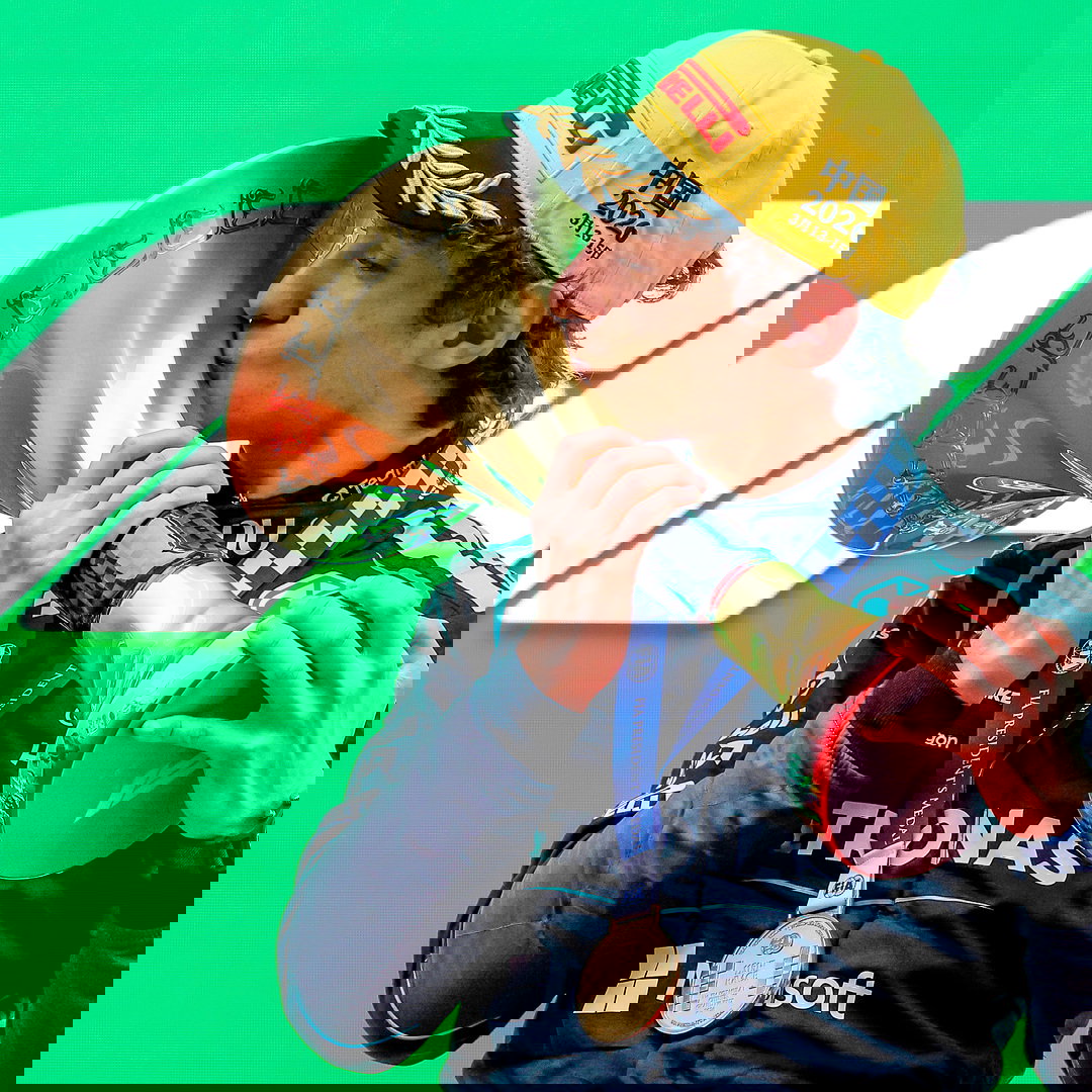 Antonelli kisses the winners' trophy on the Shanghai podium