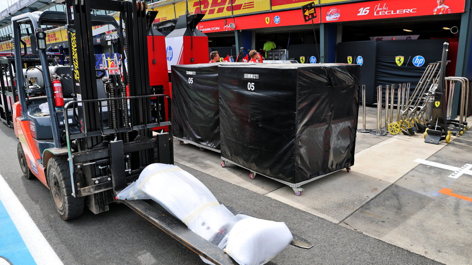 Ferrari's freight is unloaded in the Melbourne pit lane