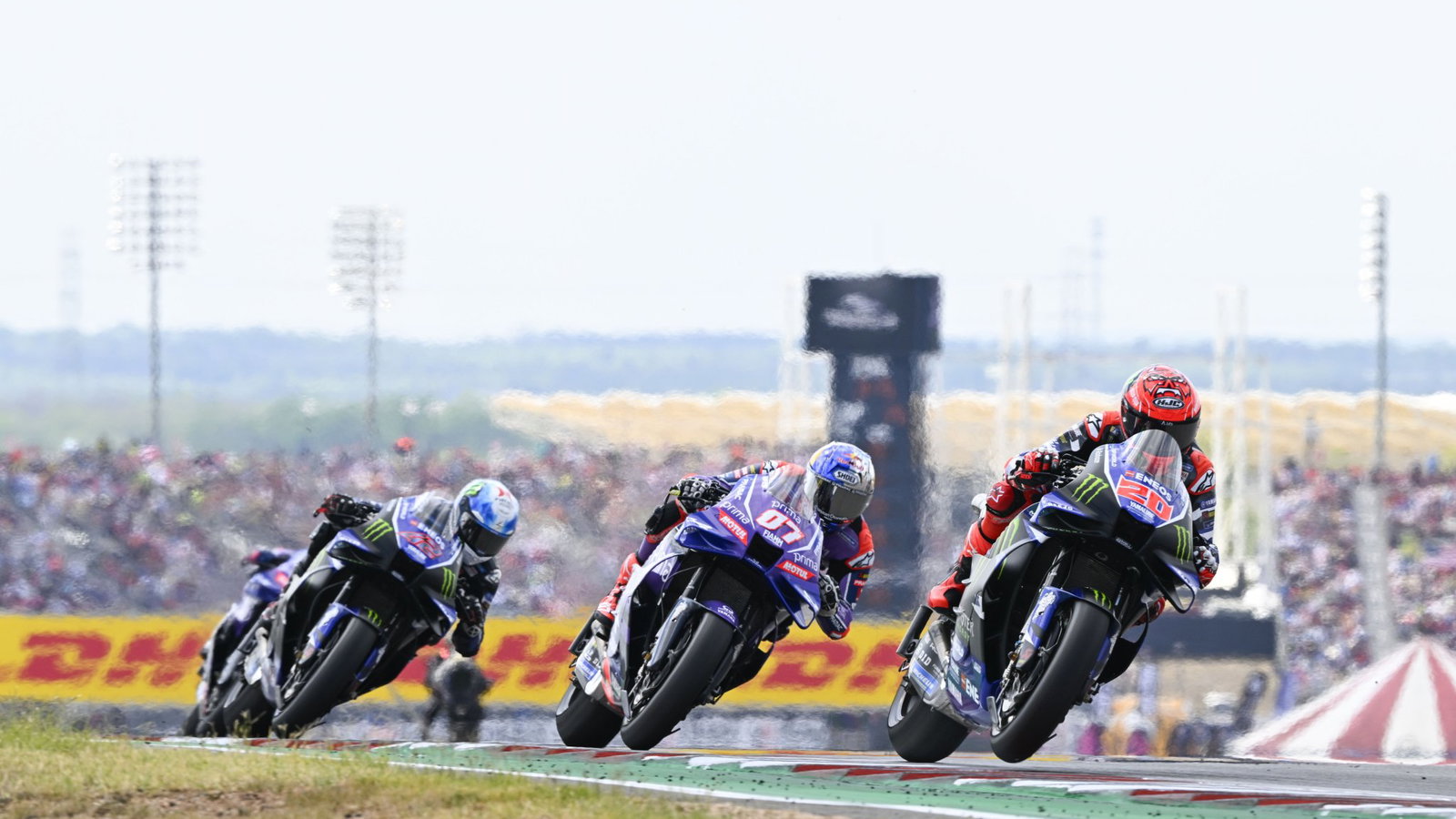 Fabio Quartararo leads Toprak Razgatioglu and Alex Rins, 2026 MotoGP US Grand Prix. Credit: Gold and Goose.