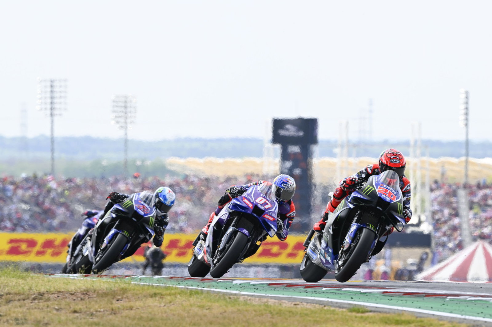 Fabio Quartararo leads Toprak Razgatioglu and Alex Rins, 2026 MotoGP US Grand Prix. Credit: Gold and Goose.
