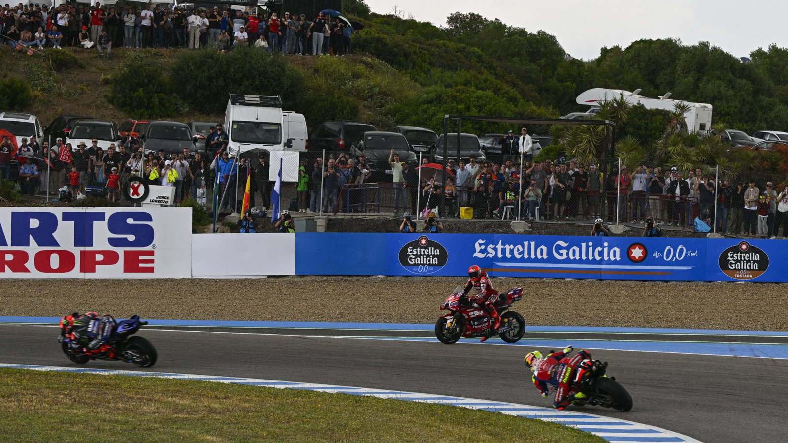 Marc Marquez waits to cross the track after crashing in 2026 Spanish MotoGP Sprint. Credit: Gold and Goose.