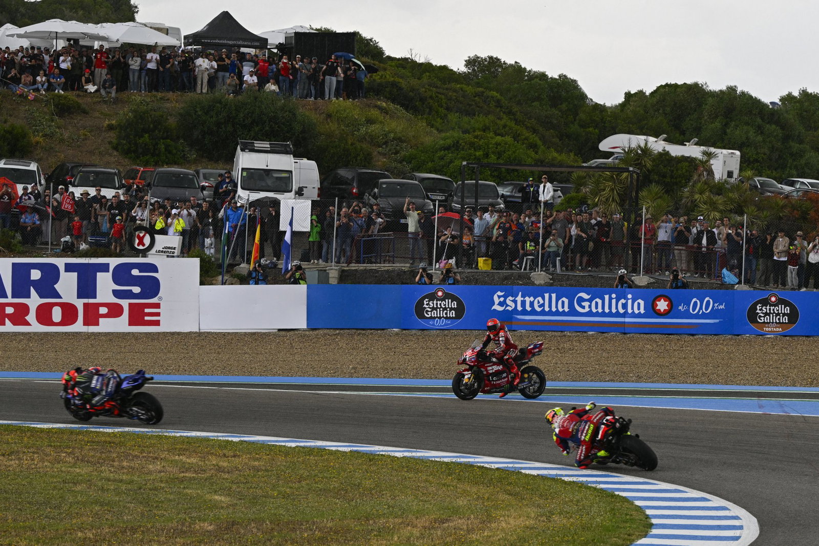 Marc Marquez waits to cross the track after crashing in 2026 Spanish MotoGP Sprint. Credit: Gold and Goose.