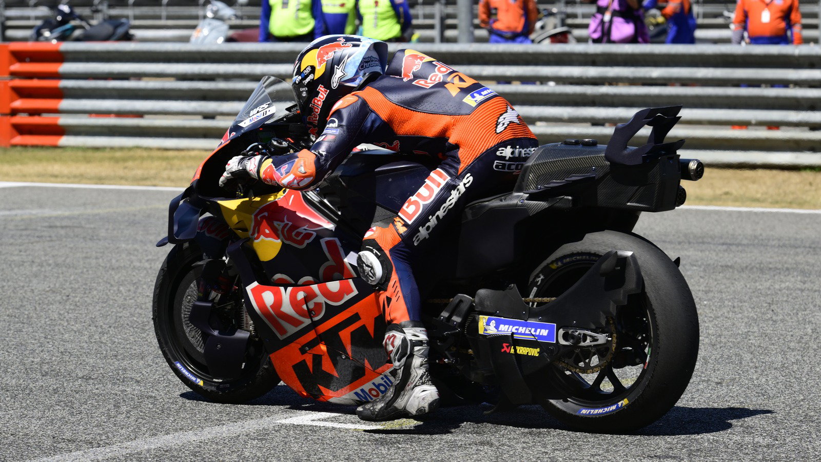 MotoGP bike with front and rear holeshot lowering devices activated.