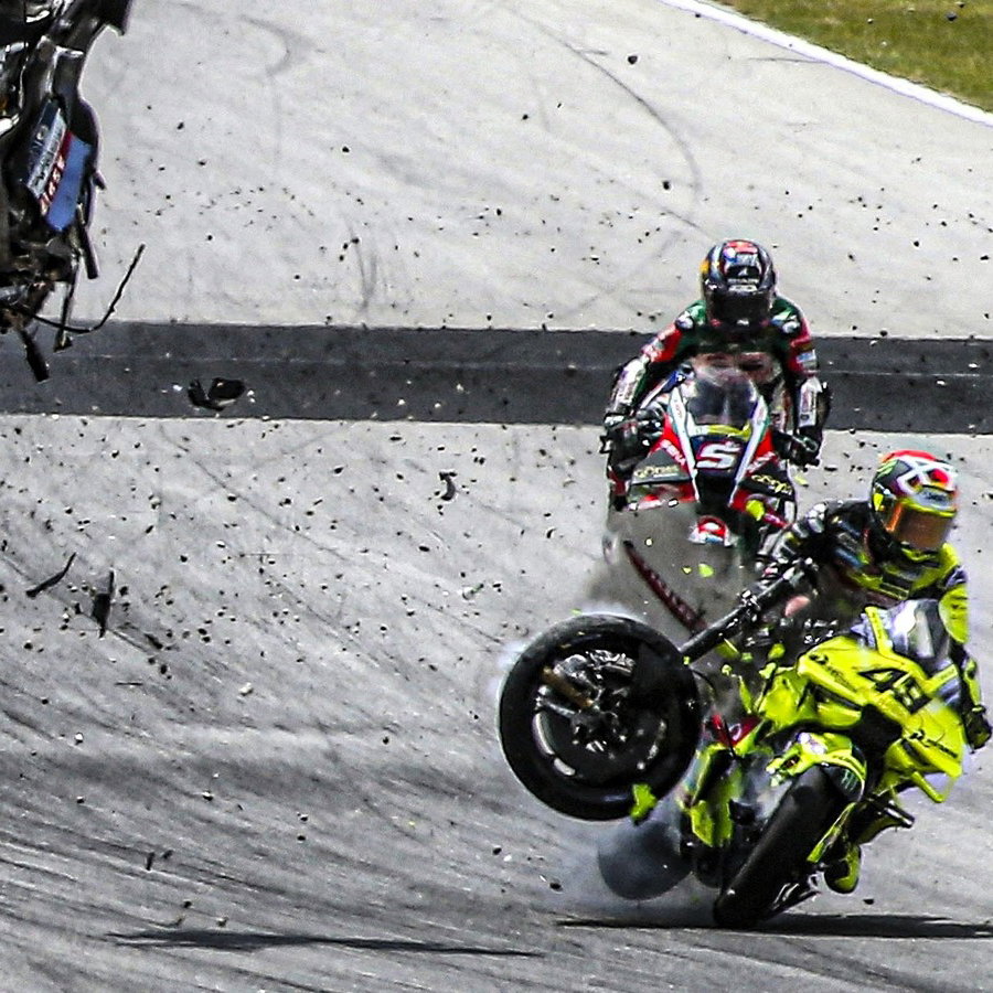 Fabio di Giannantonio hit by debris from Alex Marquez's bike, 2026 Catalan MotoGP.