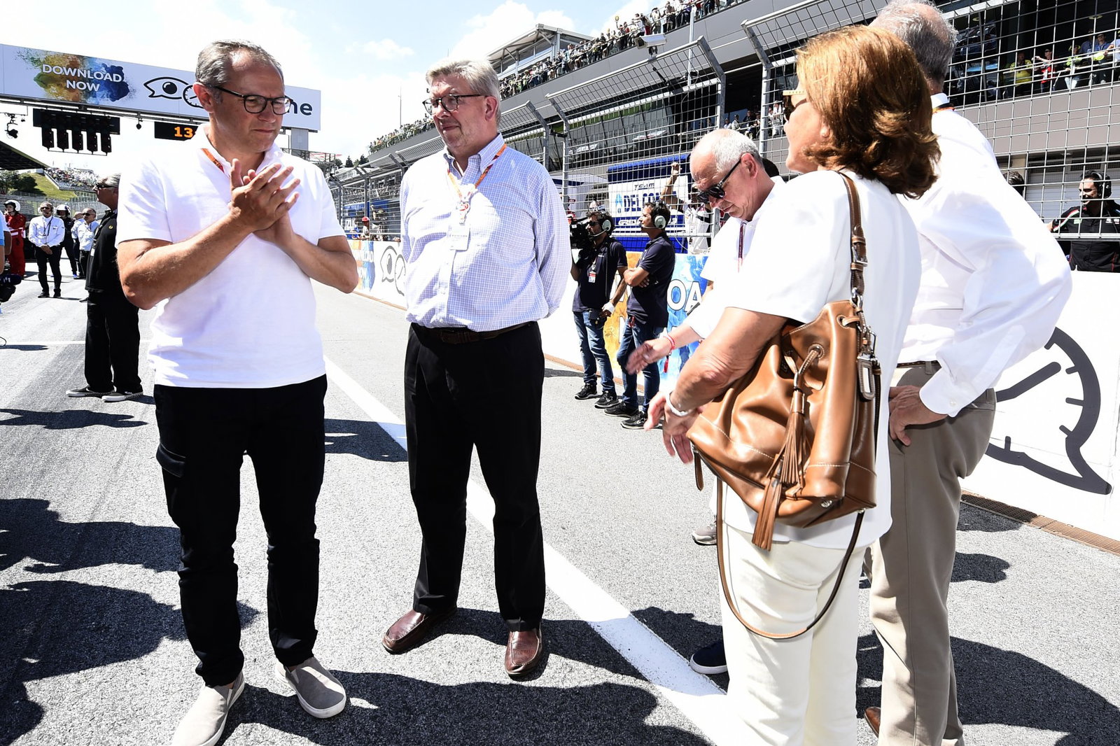 Ross Brawn with Stefano Domenicali at 2018 MotoGP Austrian Grand Prix. Credit: Gold and Goose.