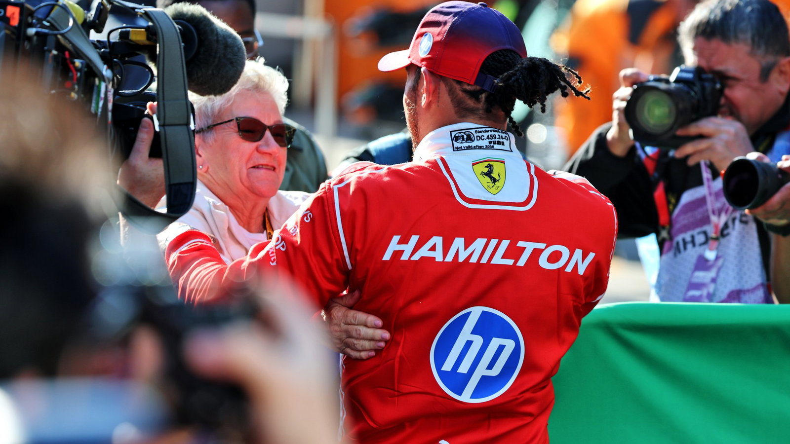 Hamilton celebrates with his mother 