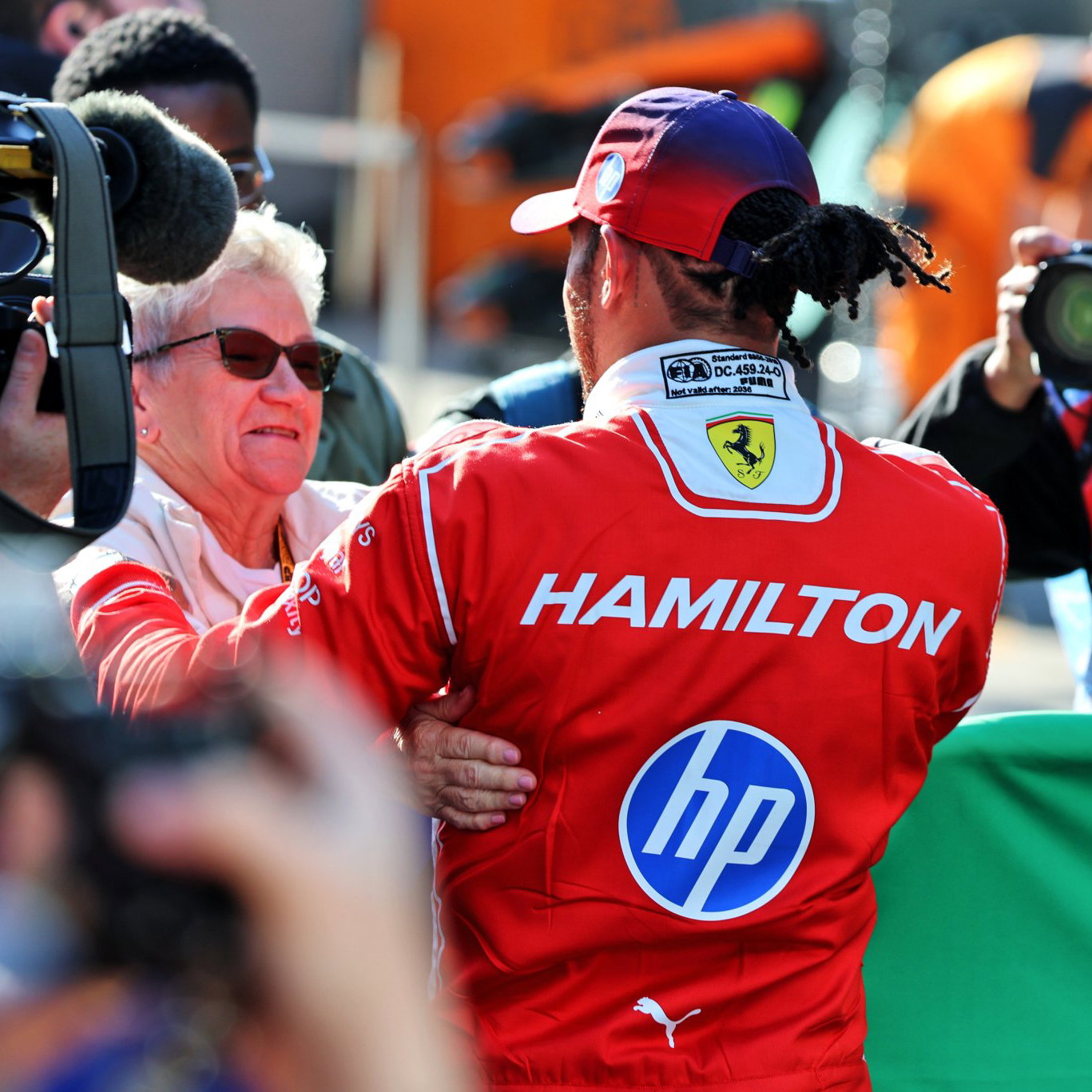 Hamilton celebrates with his mother