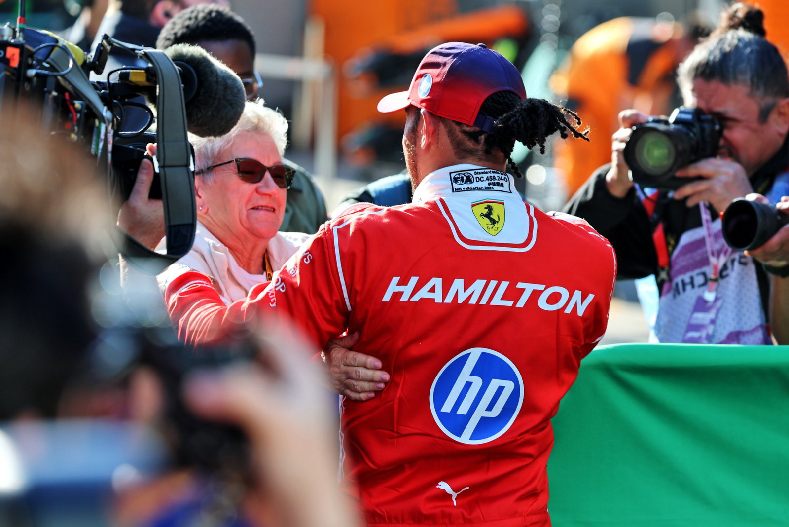 Hamilton celebrates with his mother 