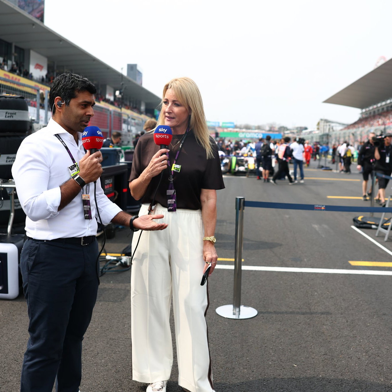 Karun Chandhok and Rachel Brookes on the F1 grid in Japan