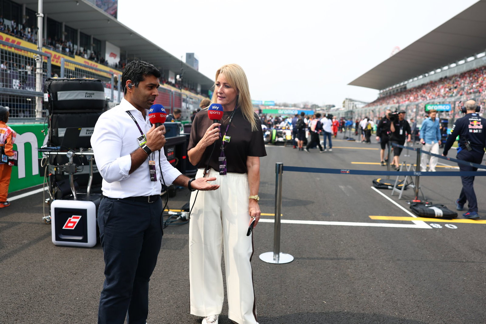 Karun Chandhok and Rachel Brookes on the F1 grid in Japan