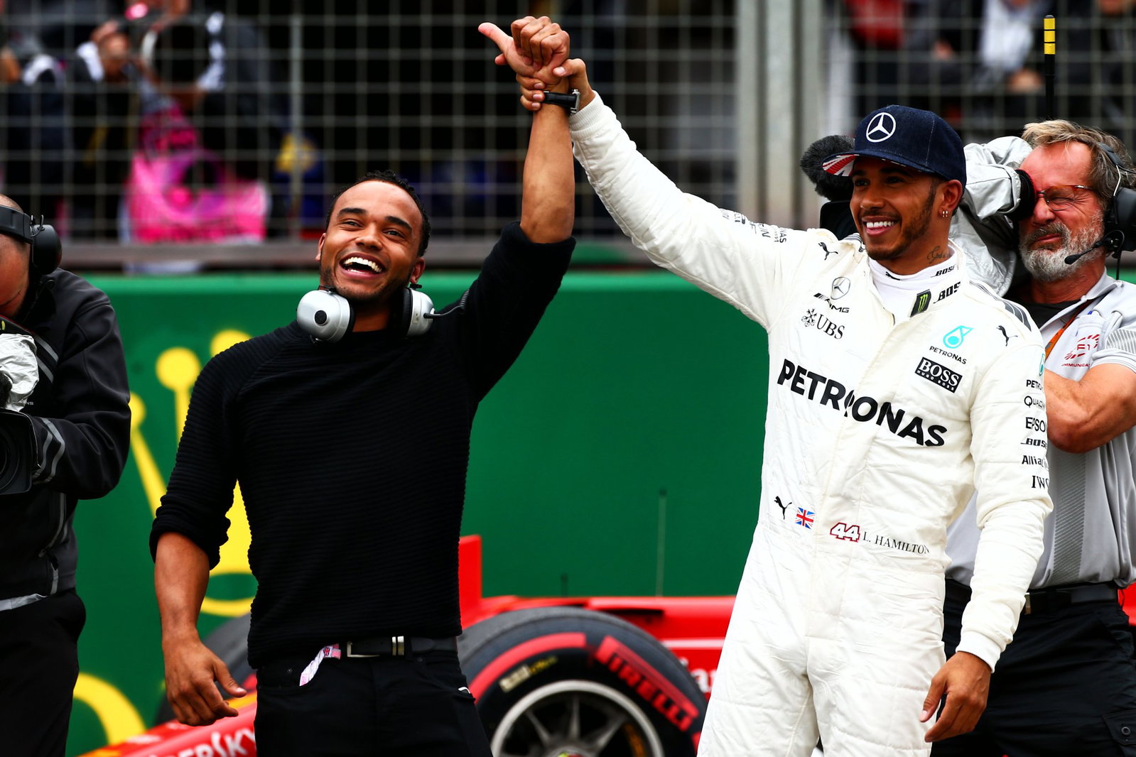 Lewis and Nicolas Hamilton celebrate together