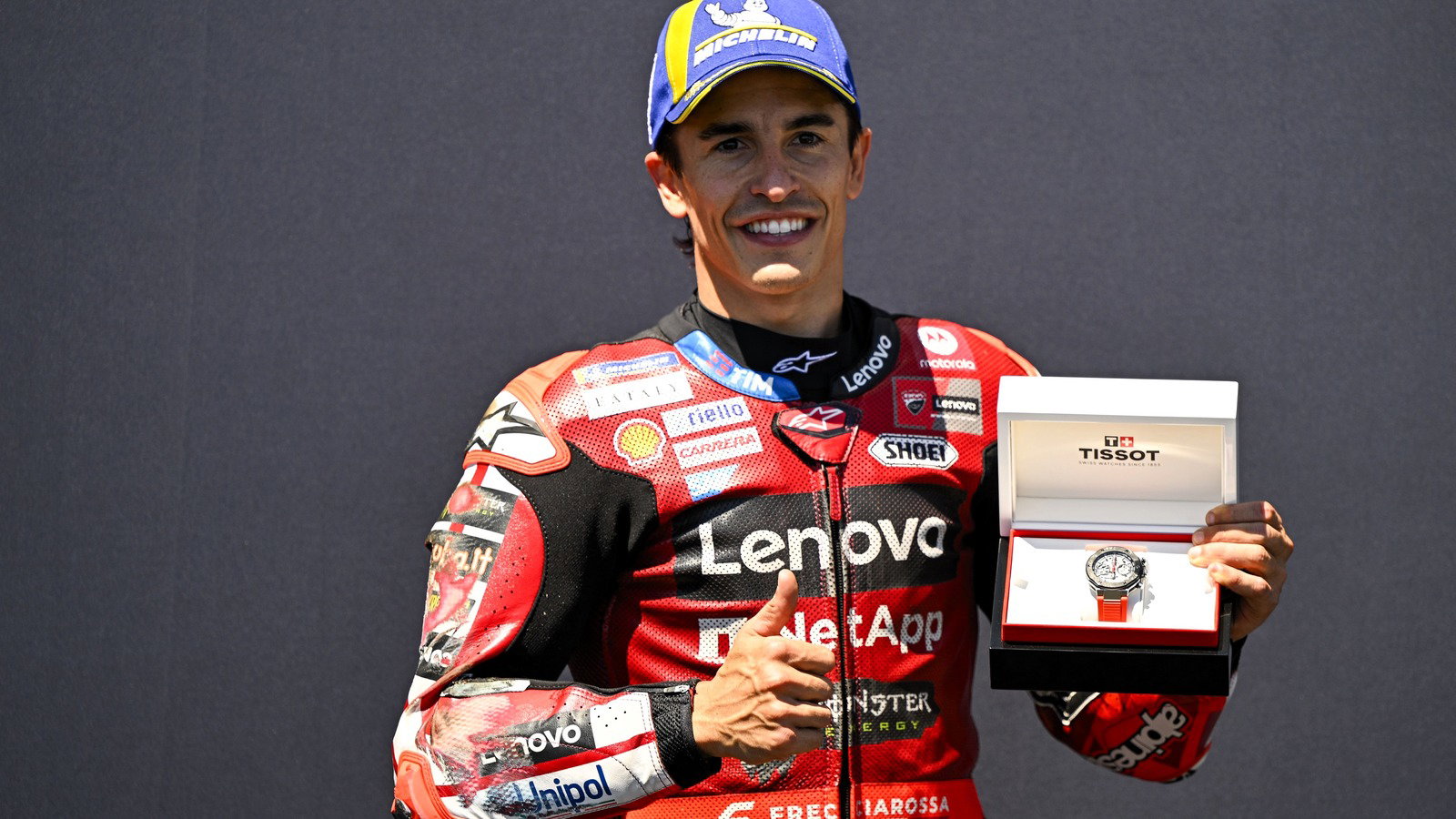 Marc Marquez celebrates his first pole since his latest shoulder surgery.