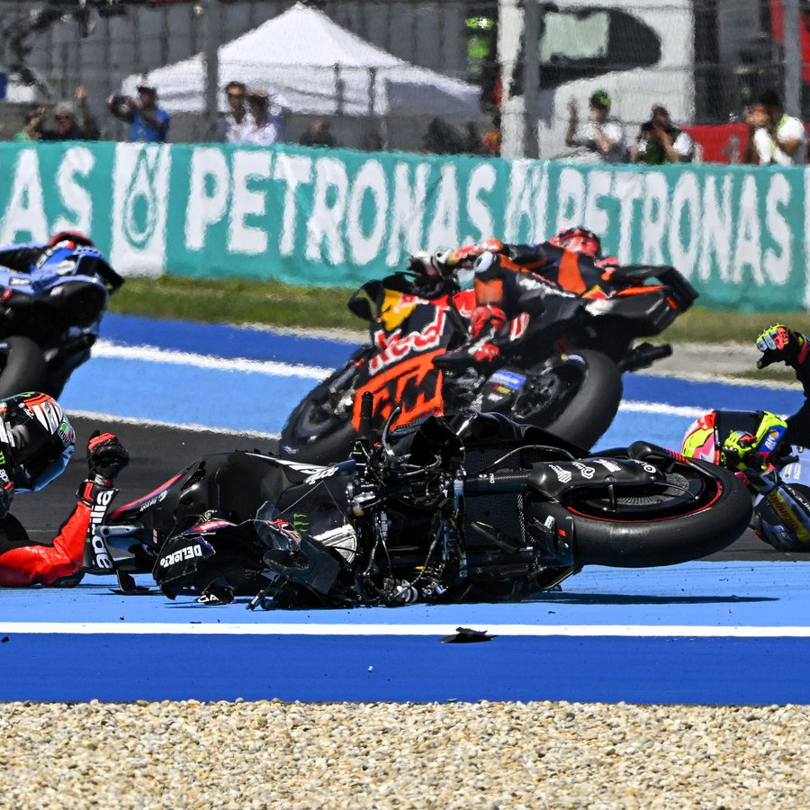 Iker Lecuona rides past while team-mate Fermin Aldeguer is caught up in Turn 1 incident, 2026 Hungarian MotoGP. 