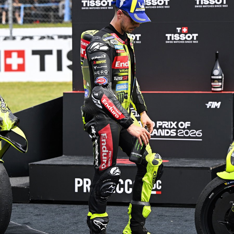 Fabio di Giannantonio looks at the Aprilia, 2026 Assen MotoGP Sprint. 2026 Assen MotoGP. 