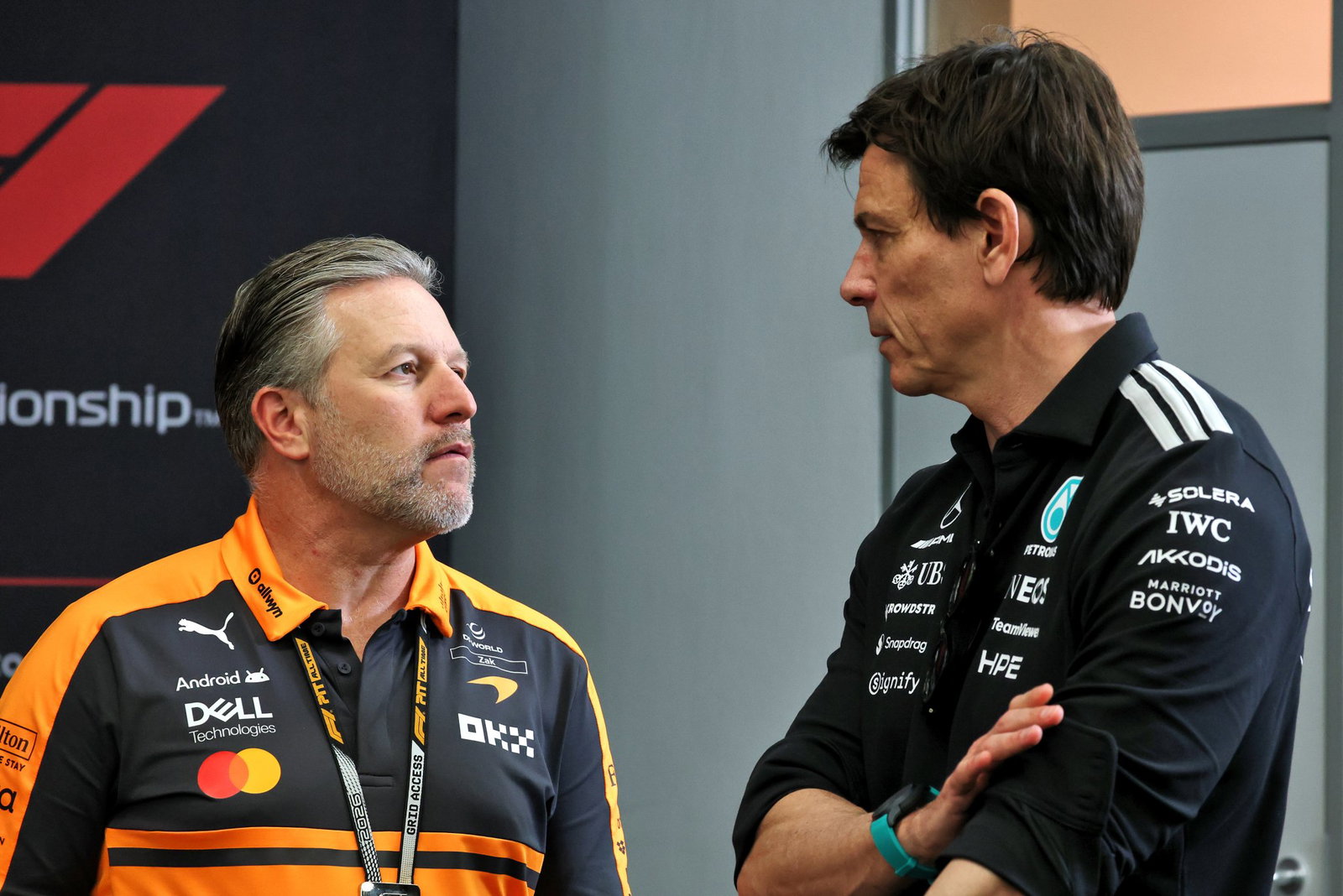 Brown and Mercedes boss Wolff chat in the paddock 