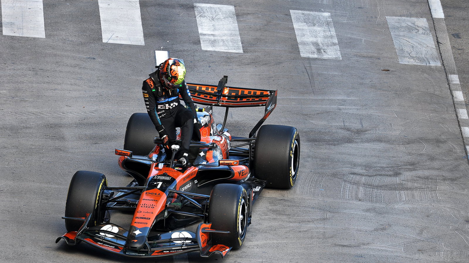 Norris climbs out of his stricken McLaren 