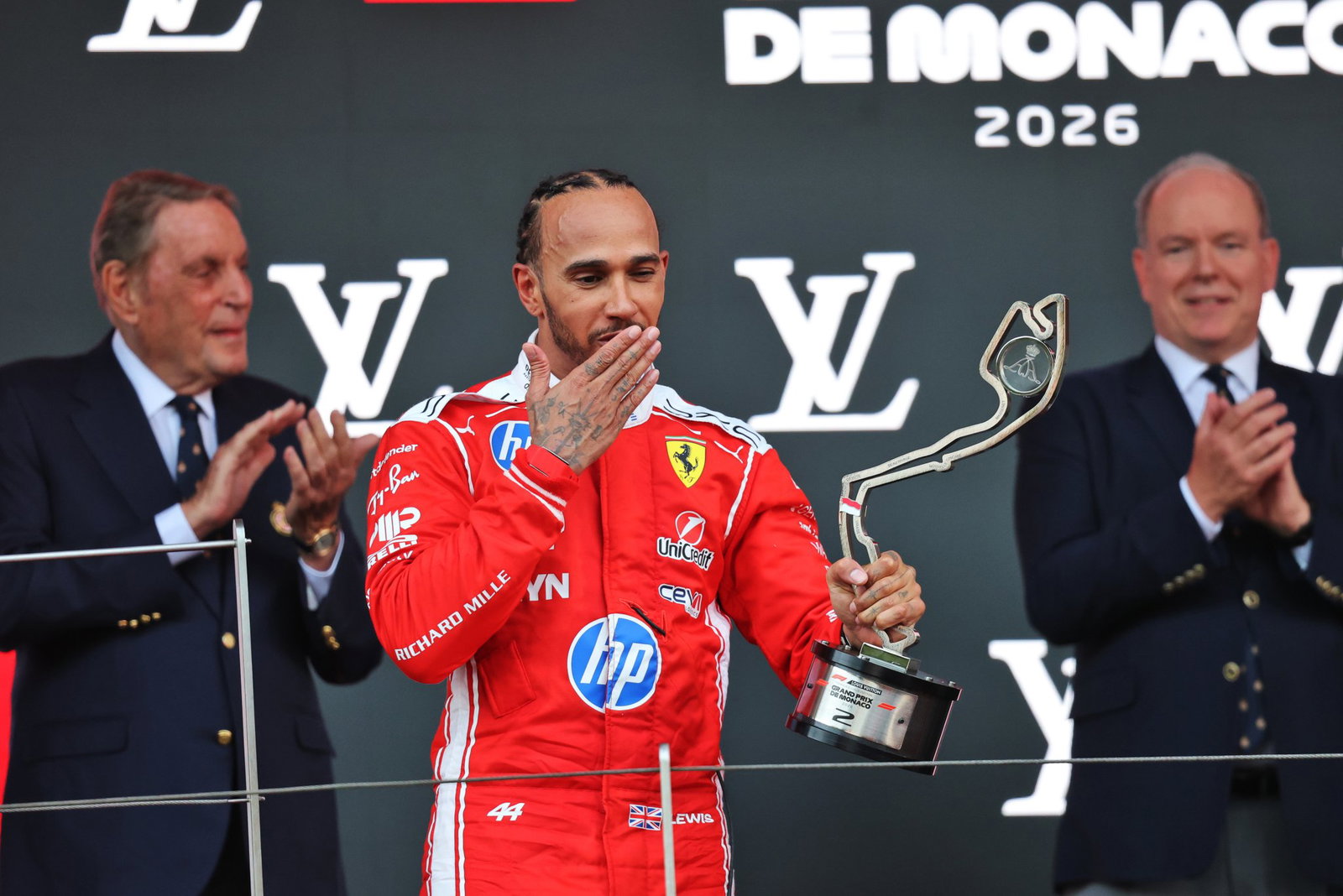 Hamilton blows a kiss to Kardashian from the podium