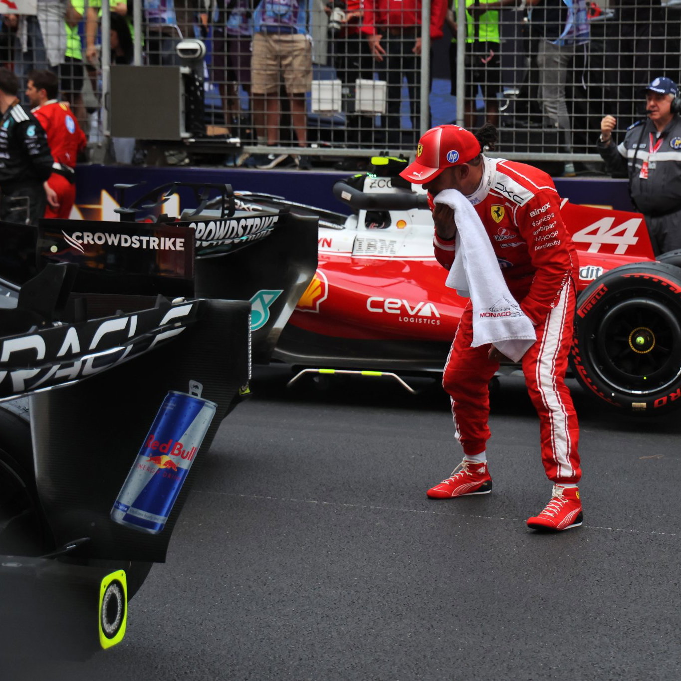 Hamilton inspects the Mercedes after the Monaco Grand Prix