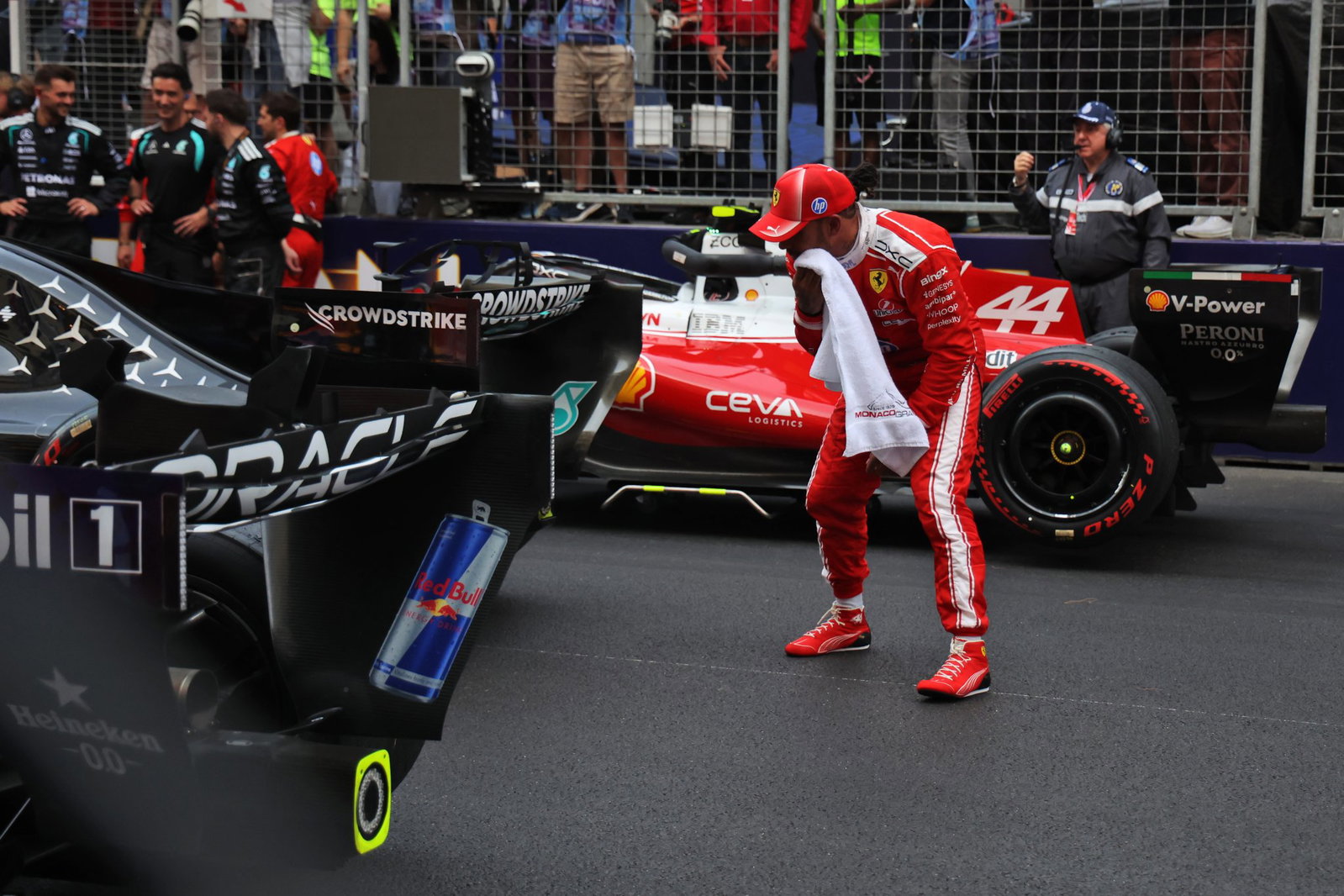 Hamilton inspects the Mercedes after the Monaco Grand Prix