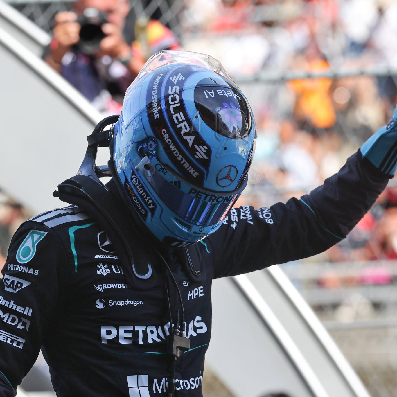 Russell celebrates taking an important pole