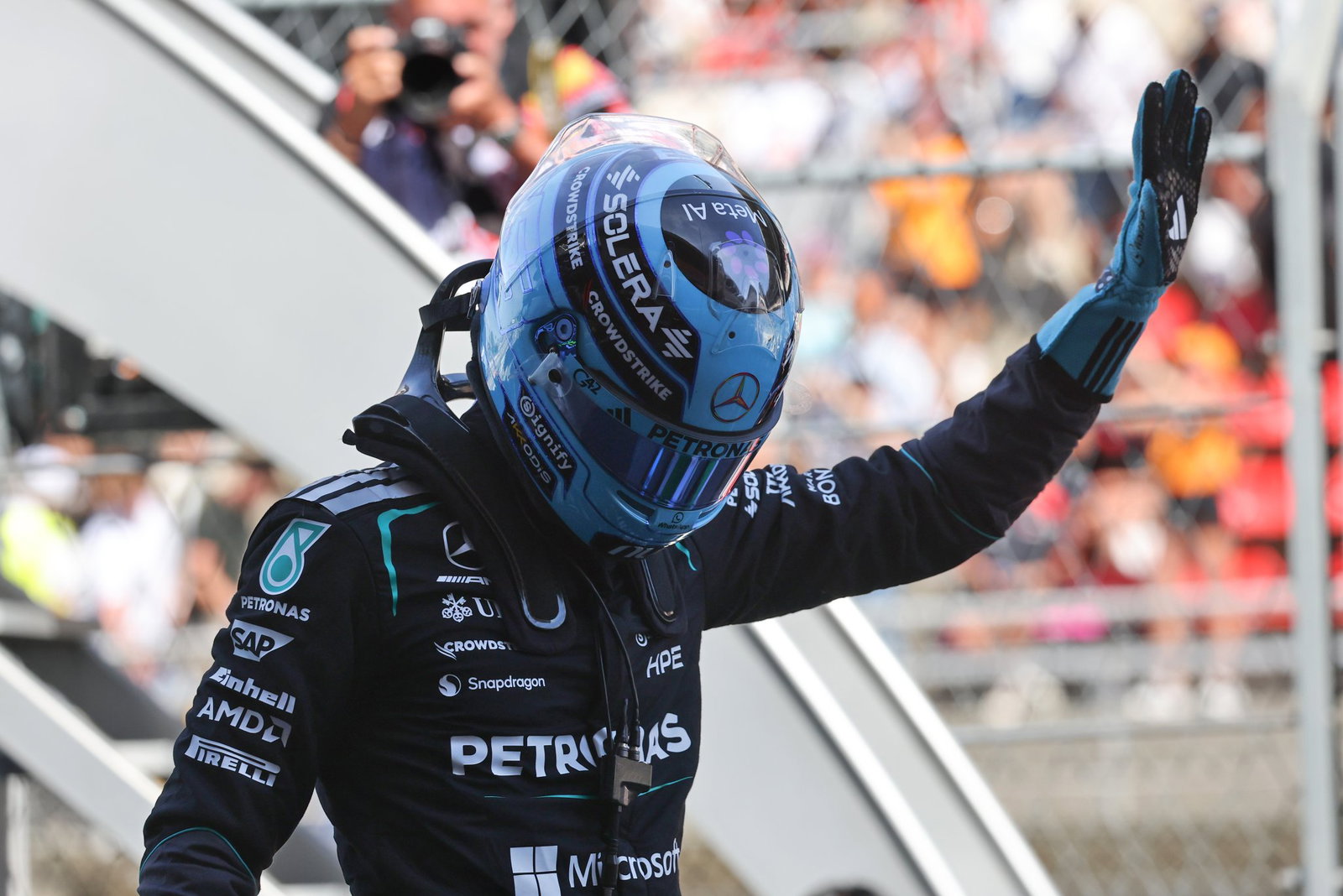Russell celebrates taking an important pole