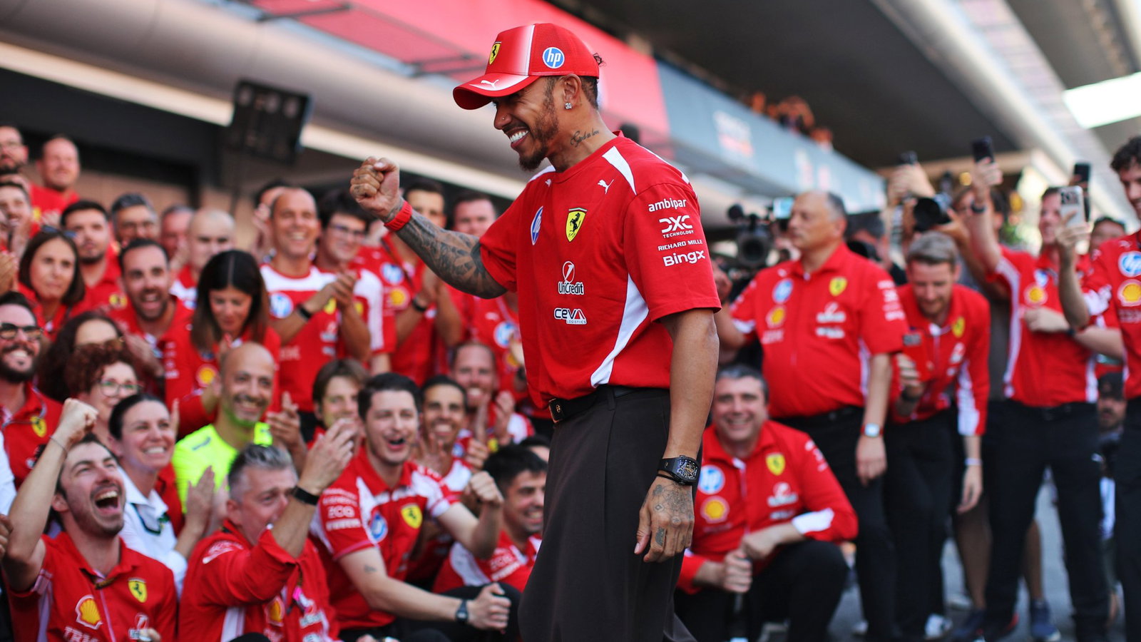 Hamilton celebrates his first win with his Ferrari team 