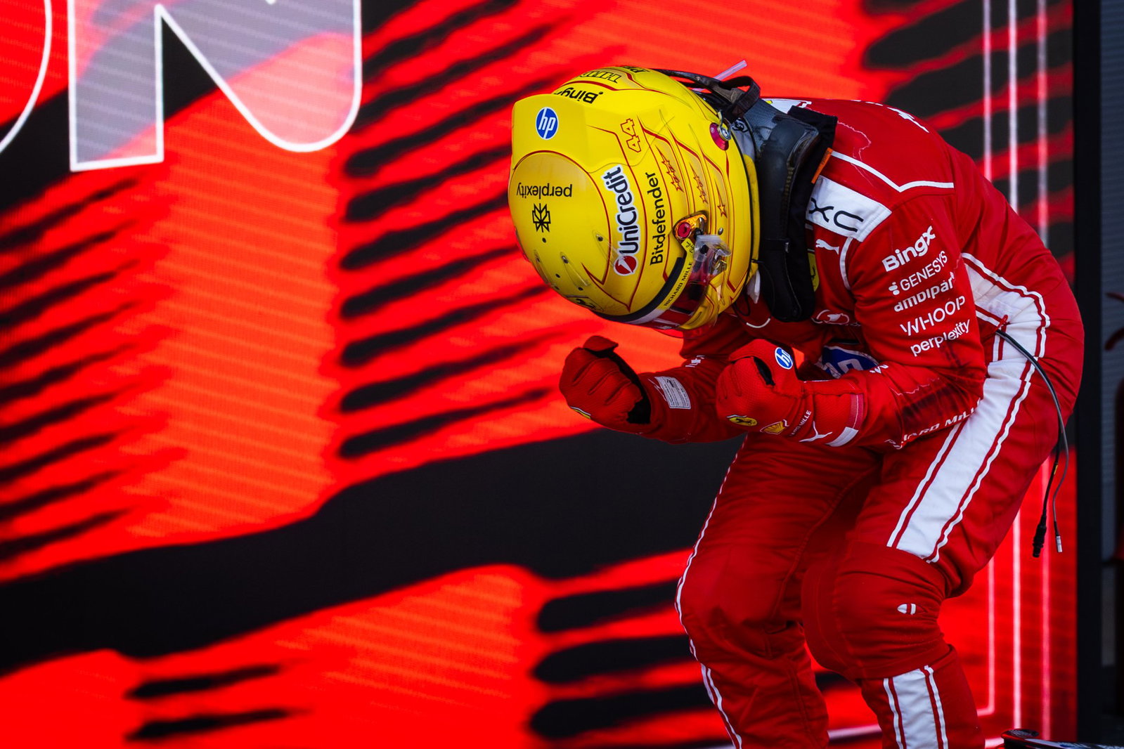Hamilton celebrates his first Grand Prix victory as a Ferrari driver