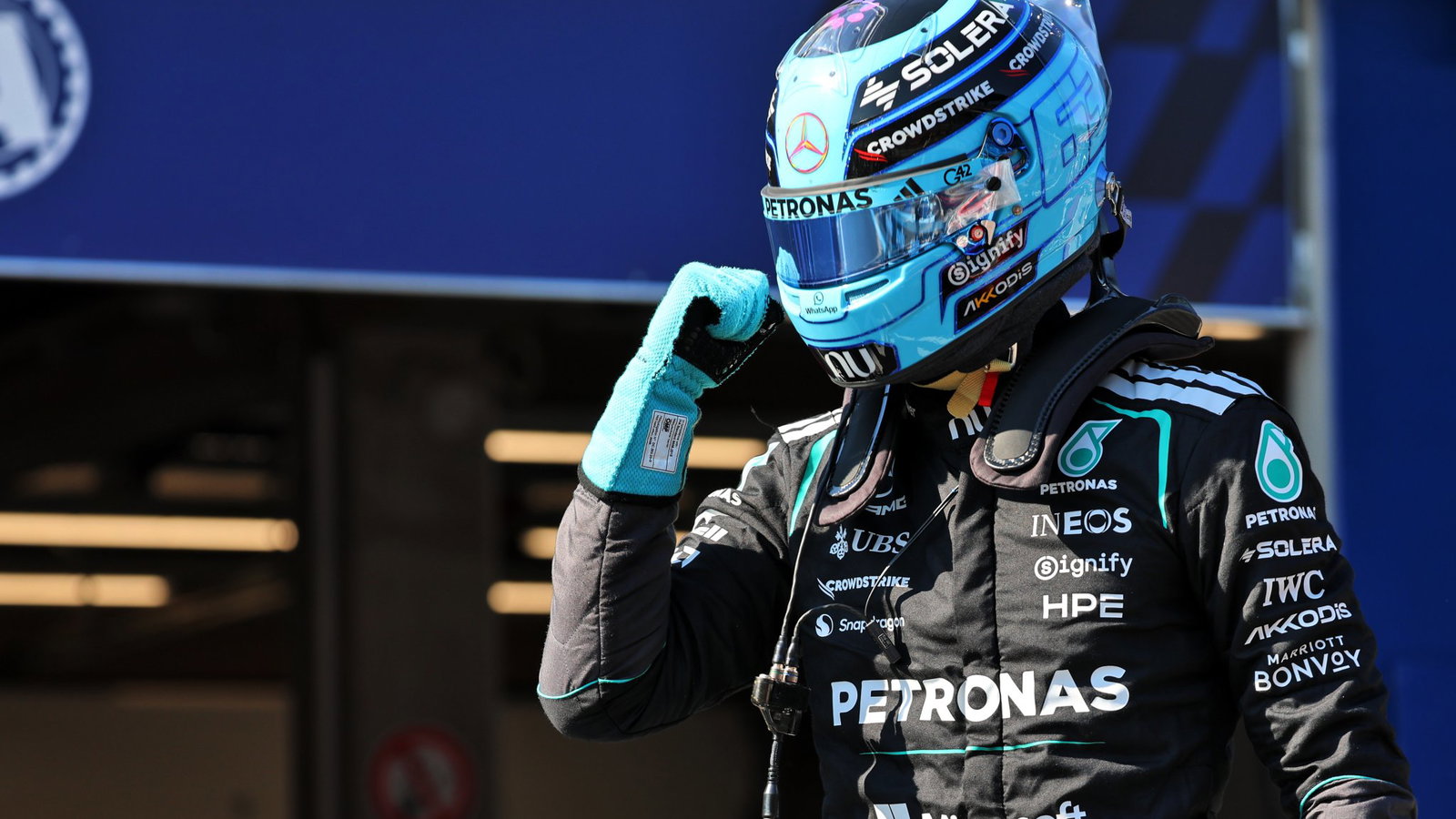 Russell celebrates a controversial pole