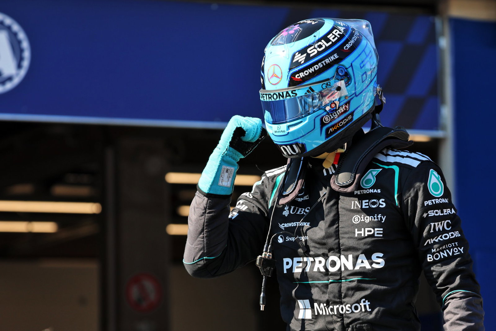 Russell celebrates a controversial pole