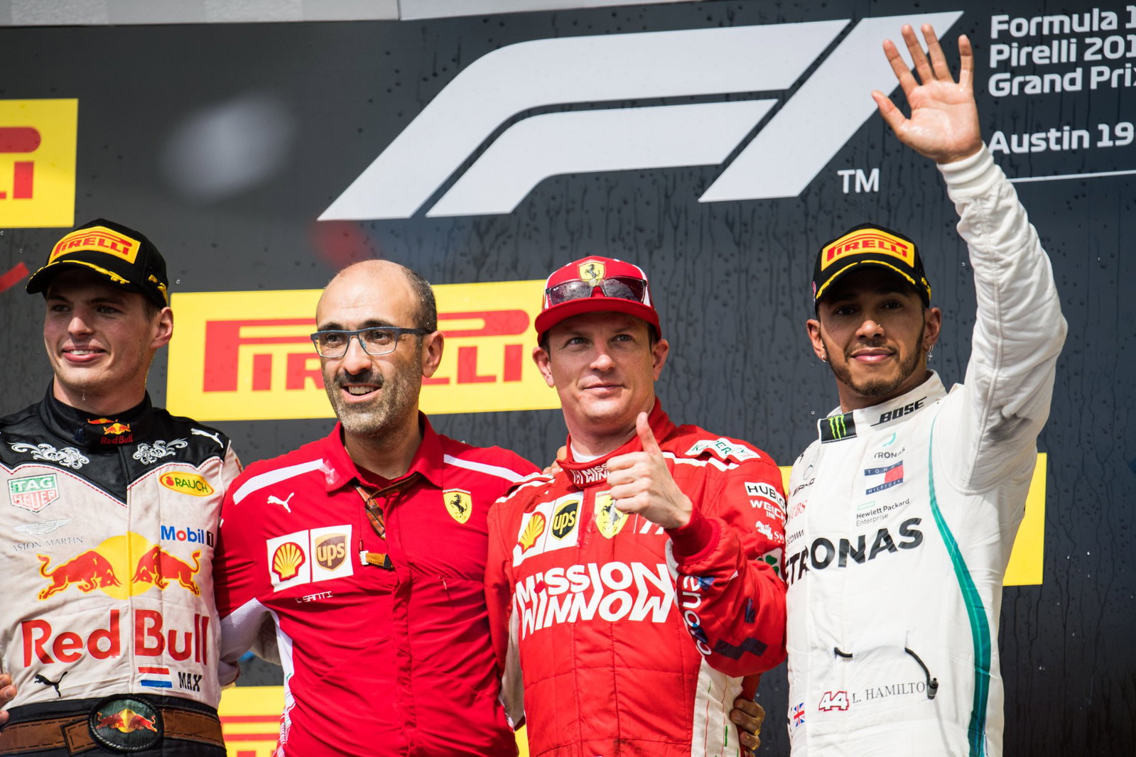 Santi on the podium with Raikkonen and Hamilton at the 2018 US Grand Prix