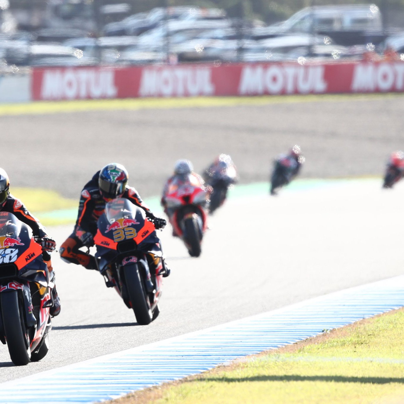Miguel Oliveira leads Brad Binder, 2022 MotoGP Japanese Grand Prix. Credit: Gold and Goose.